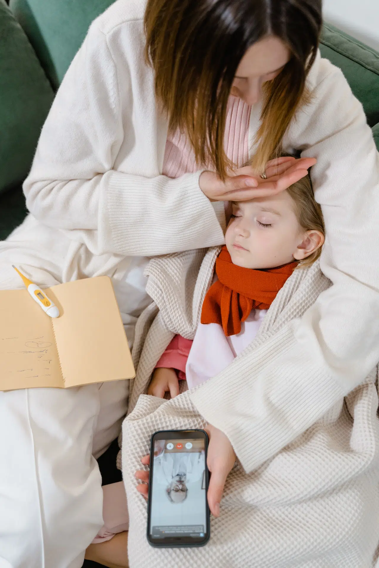 Can Telemedicine Be the Solution to Antibiotic Overprescription? 2 mother child has fever telemed doctor on phone-telehealth-telemedicine